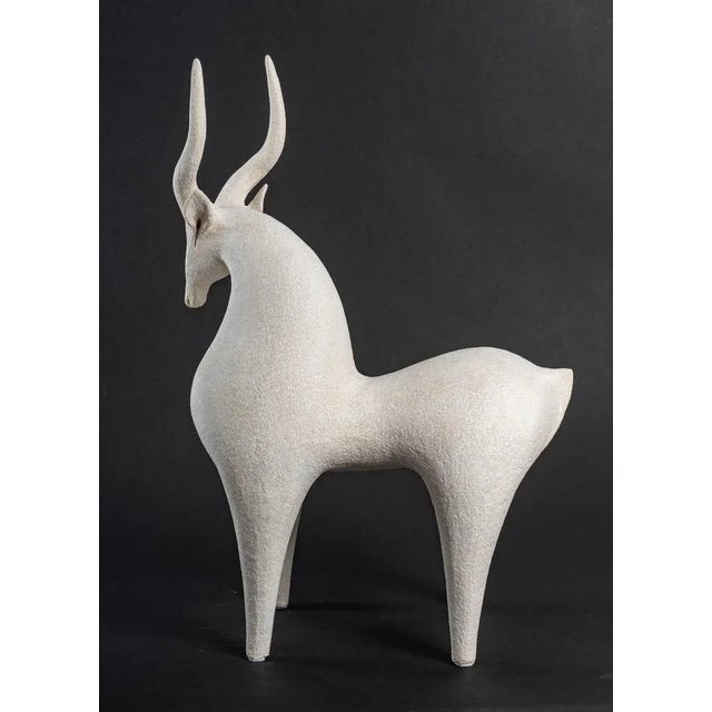 Contemporary animal sculpture in beige sandstone Signed by Maker