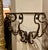 An exceptional and increasingly rare set of four 19th-century Italian wrought iron wall brackets, handcrafted in Tuscany—a...