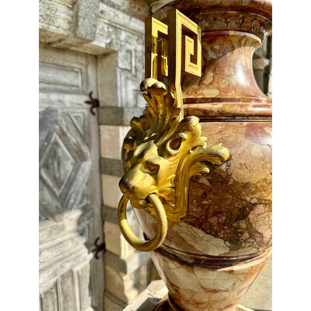 Very large Sarrancolin Ilhet marble vase, late 19th century. On either side are gilt bronze lion's head finials and a...