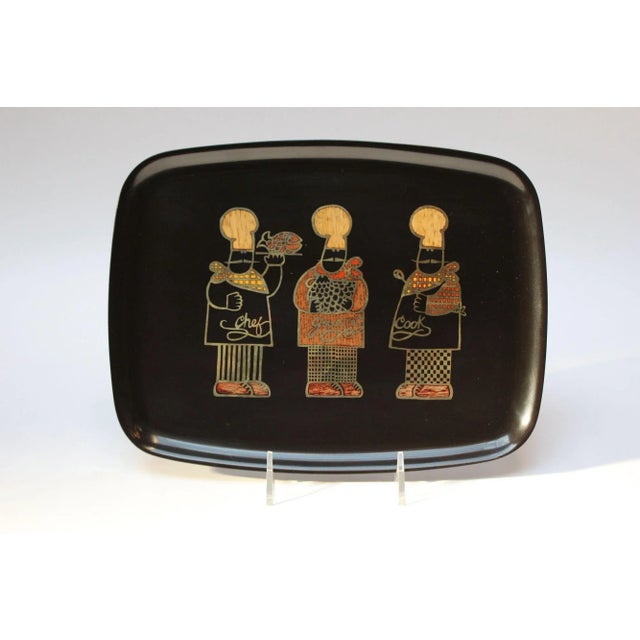 Rectangular tray by Couroc of Monterey, California with an inlaid trio of chefs noted as "chef," "gourmet," and "cook,"...