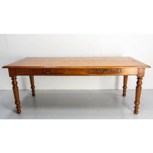 This cherrywood and oak dining table of the Louis Philippe period was made in France in the first half of the 19th...