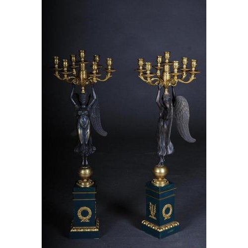 A pair of Empire ceremonial candelabras / candlesticks after P. P. Thomire Victoria standing on a gold ball in a long,...