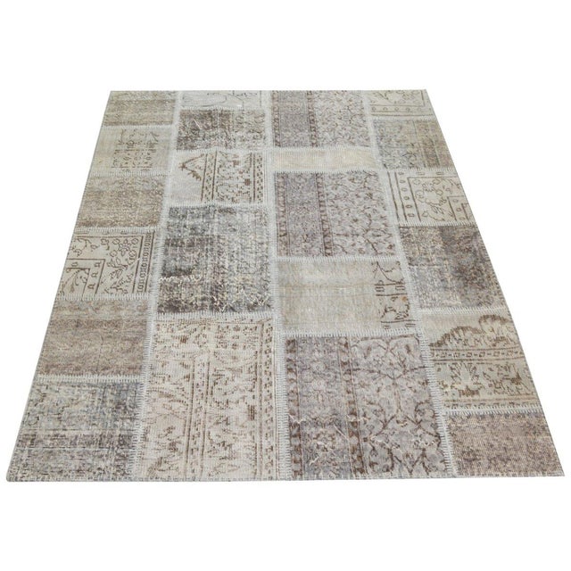 Hand-knotted with care using traditional rug-making techniques, this wool rug blends timeless craftsmanship with a modern...