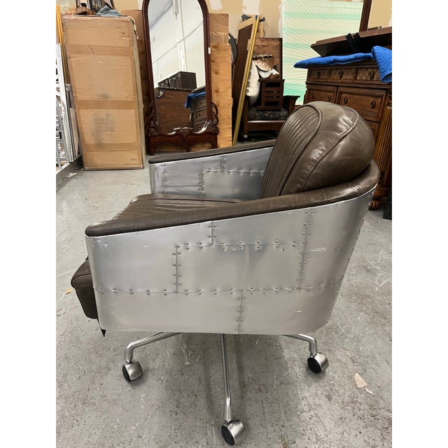 The Restoration Hardware Teen Brown Leather & Aluminum “Aviator” Office Chair blends vintage aviation style with modern...