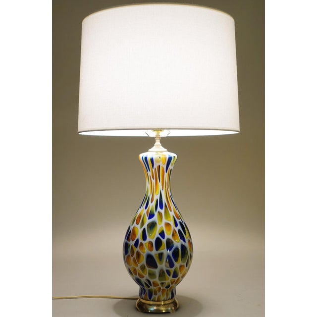 A sculpturally sensual hand blown controlled "Mosaic" Millefiori Art Glass and Brass table lamp designed and manufactured...