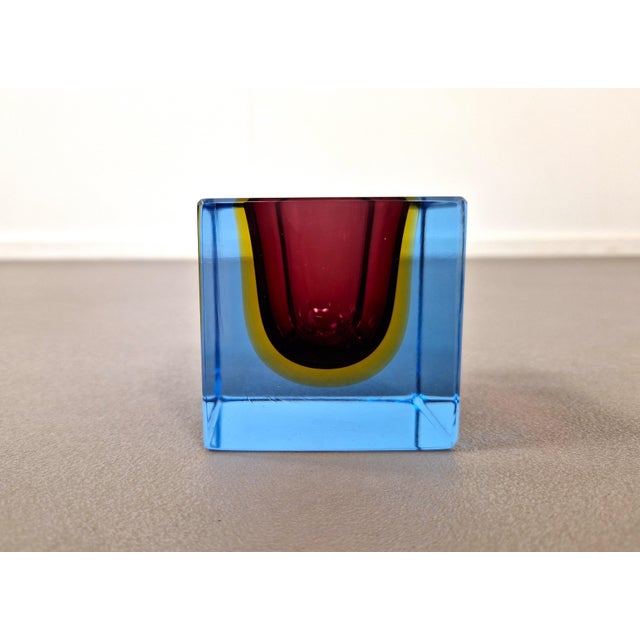 Amazing glass cube bowl from the Italian Murano island in the style or by Flavio Poli for Seguso. Superb caged colors of...