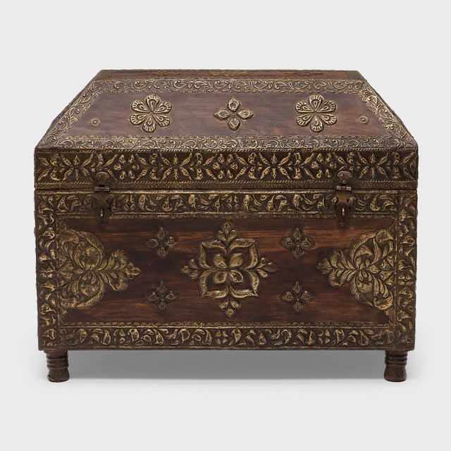 Styled after traditional dowry chests, this Indian storage trunk is a lovely example of traditional craftsmanship. Crafted...