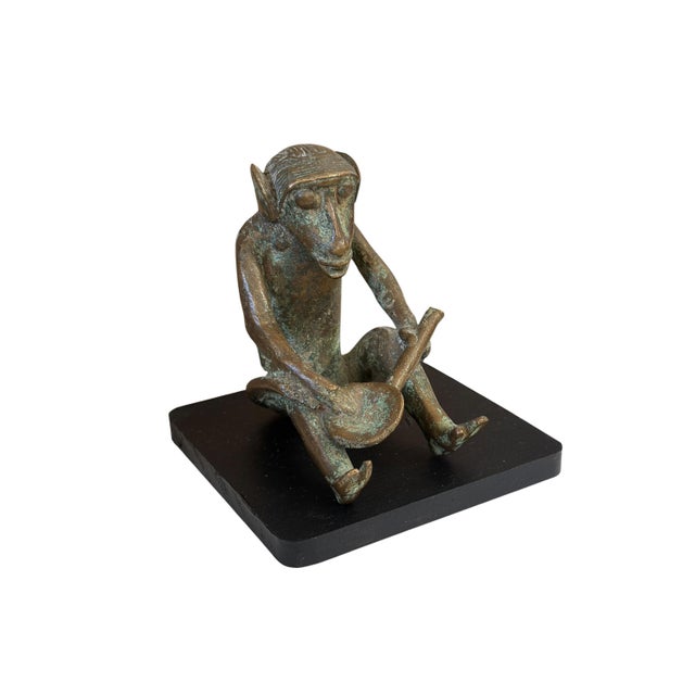 Superb vintage cast solid bronze African tribal sculpture from the Ashanti Akan people of Ivory Coast. This seated monkey...