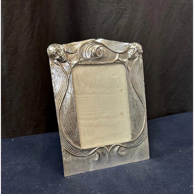 This exceptional vintage early 20th century Art Nouveau period photo frame is beautifully sculpted in silver-plate. The...
