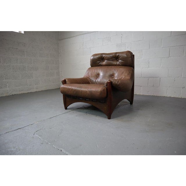 Lounge chair "Ranger" with ottoman by Erik Deforce (Rik Def) for Gervan, 1970. This leather lounge chair with oak veneer...