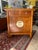 Beautiful vintage Asian-inspired solid wood cabinet featuring classic Ming-style design with a warm honey-toned finish and...