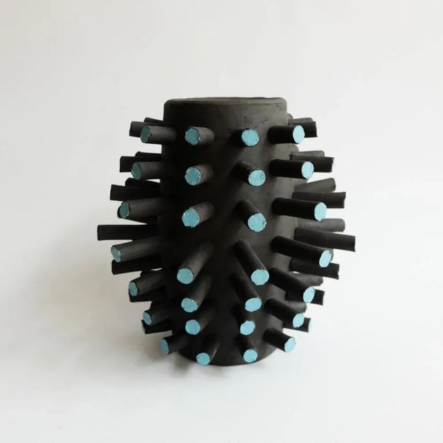 Sculptural cyto vessel by ia kutateladze dimensions: w 25 x h 25 cm materials: raw black clay “playground for salvation”...