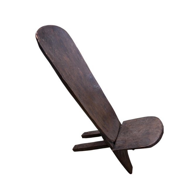 Wonderful and simple small Senufo stargazer solid wood folding chair for kids. From the Senufo people of Ivory Coast, this...
