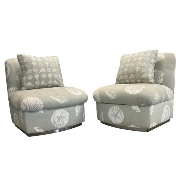 Circa 1980’s Steve Chase attributed slipped chairs. Upholstery is a pale blue linen with white printed shells. Chrome...