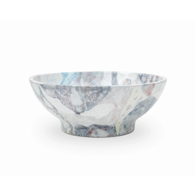 Here is a beautiful faux marble ceramic bowl. It appears to be artisan made and is certainly eye catching. Various blues...