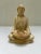 A single antique seated Buddha figurine with bowl in lap. Features a wonderful chalky finish with patina.