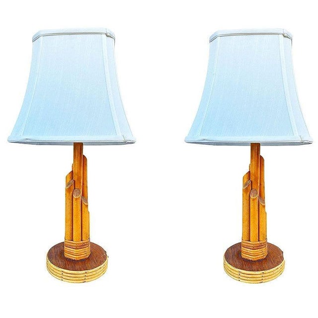 Beautifully restored coastal pair of bamboo and rattan table lamps showcases a beautifully sculptural design defined by...