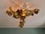 Large brutalist brass chandelier, 3 arms, floral design, 1970s. a rare and highly decorative piece. this chandelier is...