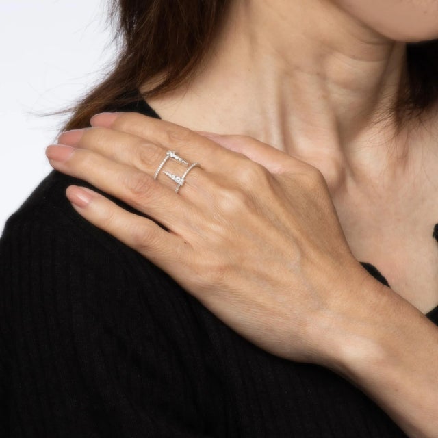 Stylish contemporary diamond 'icicle' ring crafted in 18 karat white gold. Diamonds total an estimated 0.30 carats...