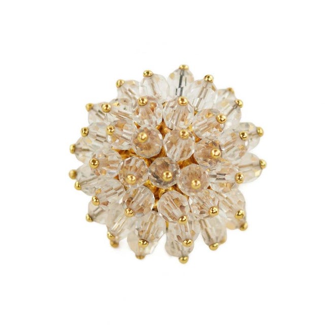 Spectacular gilded metal ring with quartz in the form of a blossoming dandelion. Hallmark. Ring size: 15.5. Weight: 19.58 g.