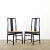 A fabulous set of six, vintage Italian-made dining chairs with black lacquer frames and woven cane seats for a modern yet...