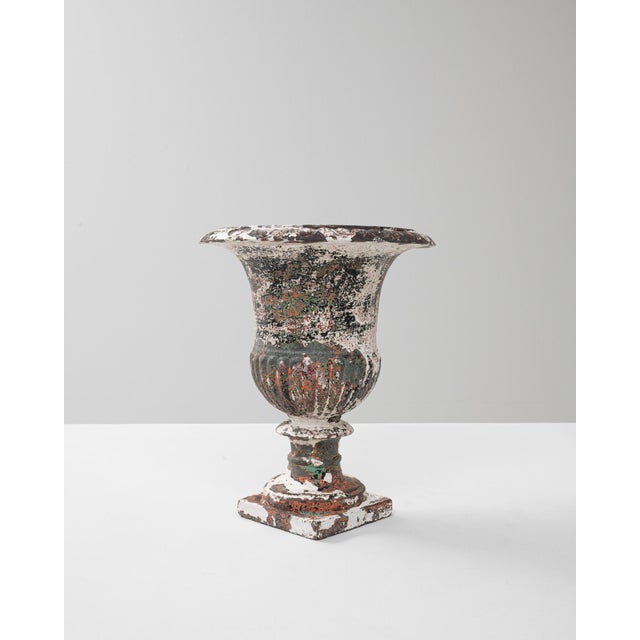 This 1900s French cast iron planter embodies the enduring elegance of classical garden ornamentation. Shaped in a...