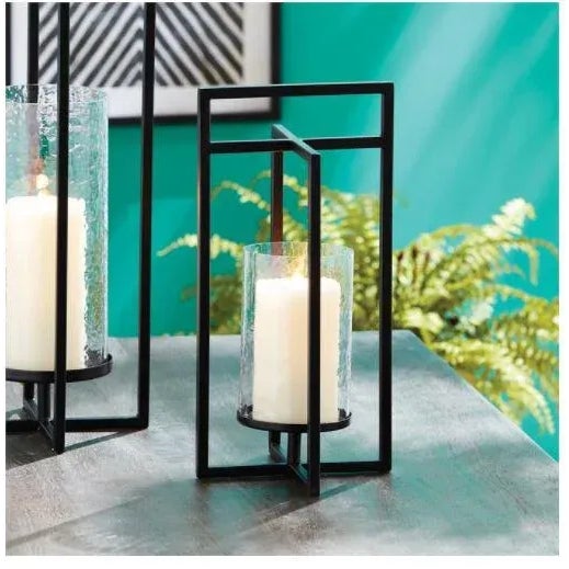 The Exton Small Lantern Mondrian-inspired, simple geometric shapes with intersecting planes make for a contemporary look....