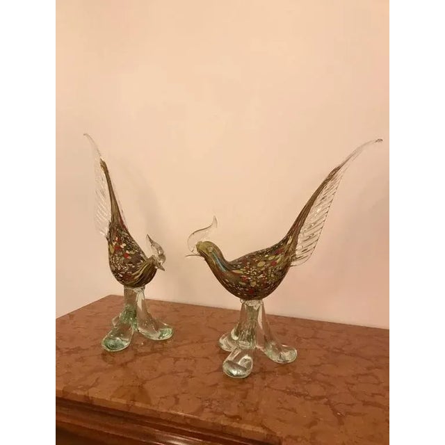 Pair of Italian Mid-Century Modern Murano handblown glass roosters sculptures. Having beautiful multi colors and clear glass.
