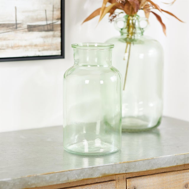 Bring fresh elegance to your space with this Sage Green Glass Vase. Standing 10.25 inches tall, this beautifully crafted...