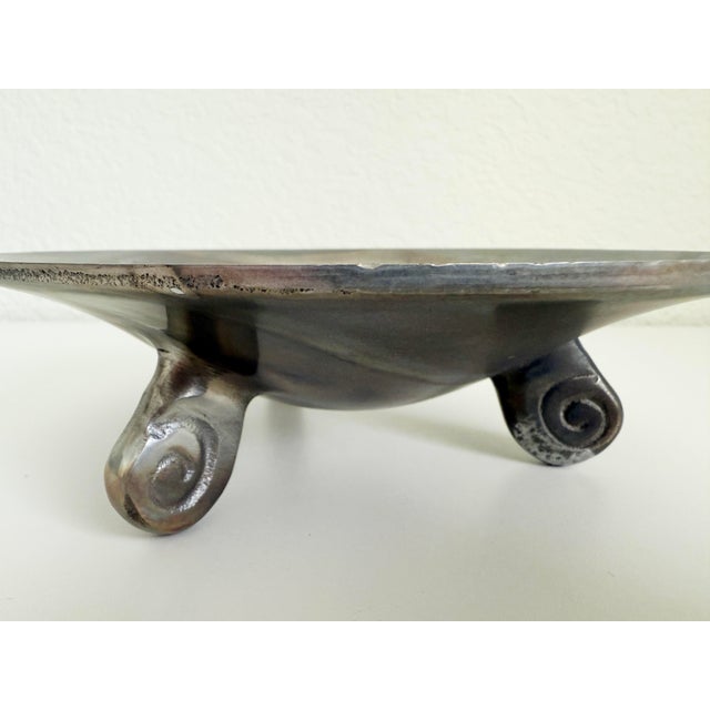 Mid 20th century cast pewter bowl catchall featuring three feet with scroll detail. Nicely aged with patina throughout....