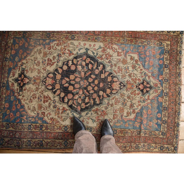 :: Oversized center medallion with double tiered finials at either end atop a covered field of delicately drawn and...