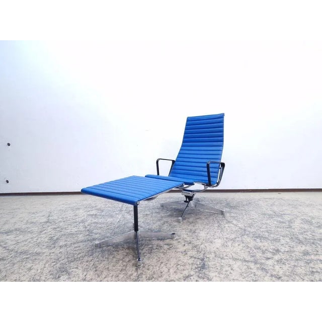 Hermann Miller Vitra Ea 124 real leather lounge chair set, including EA 125 ottoman. Designed by Charles and Ray Eames in...