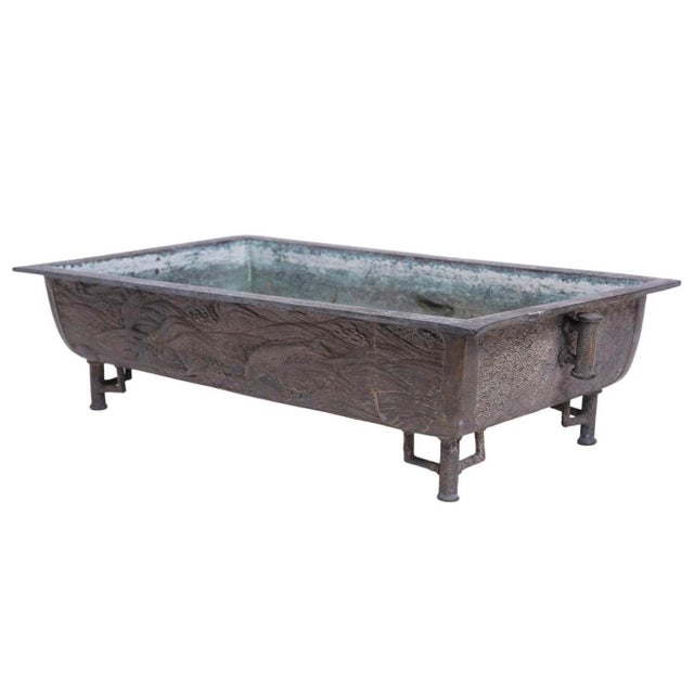 Large rectangular shaped Chinese bronze planter. Featuring low relief imagery of swimming Koi fish. Beautiful detailing...