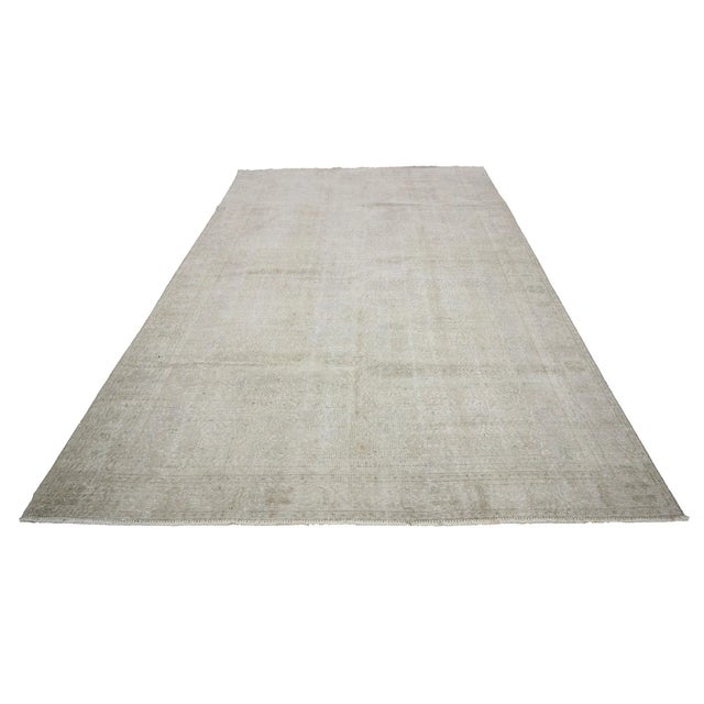 Washed out vintage handknotted rug from Oushak region of Turkey. Approximately 50-60 years old. In very good condition