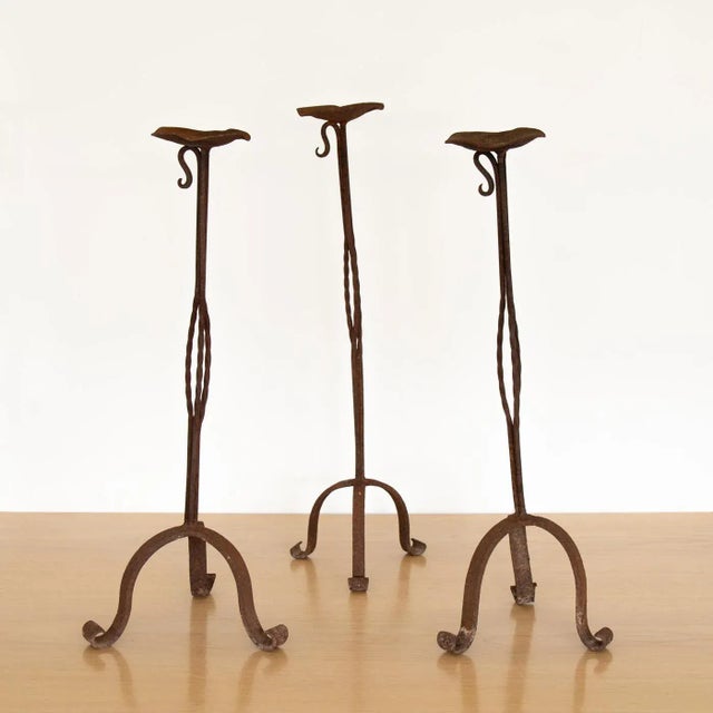 Tall vintage iron candlestick from France, 1940's. Tripod base with twisted stem detail. Iron shows nice age, patina, and...