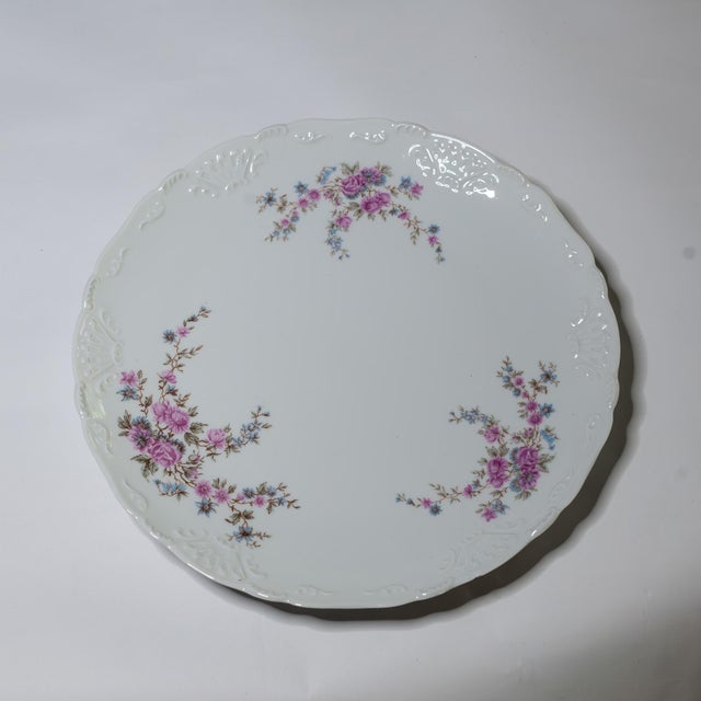 This elegant 13-piece Limoges set, crafted by Tharaud in Limoges, France, features the Romance pattern, exuding classic...