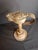 An extraordinary, highly architectural 19th-century sheet tin "Betty" grease lamp permanently integrated into a weighted...