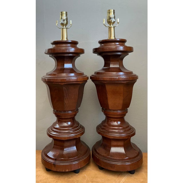 This striking pair of vintage faceted wood table lamps embodies the sculptural elegance of Mid-Century Modern design....