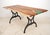 This table features a live edge slab walnut top with a blueish green epoxy resin pour on one end. The slab has been paired...