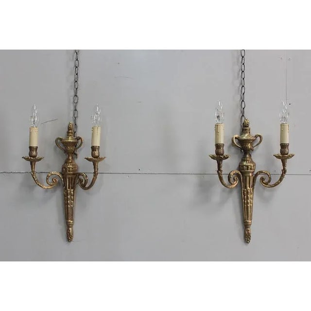 Pair of Louis XVI style electrified, bronze, 2 lights. Electrification redone. Period: late nineteenth Very good state....