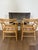 Authentic vintage McGuire armchairs featuring the brand’s signature bamboo/rattan construction with leather-wrapped...