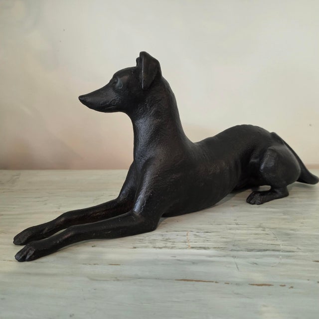 Crafted from solid sand-cast iron, this mid-century recumbent whippet captures the classic, aerodynamic form of the...
