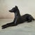 Crafted from solid sand-cast iron, this mid-century recumbent whippet captures the classic, aerodynamic form of the...