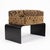Handwoven Kuba cloth from the Democratic Republic of the Congo covers this contemporary Key West bench by Outpost...