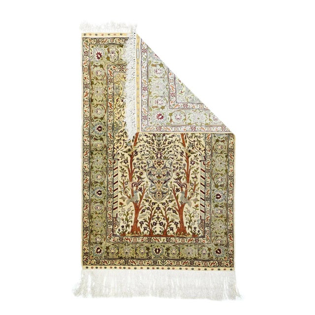 This all silk, extremely fine urban, Turkish wall-hanging shows a cream niche with a central vase flanked by two full-...