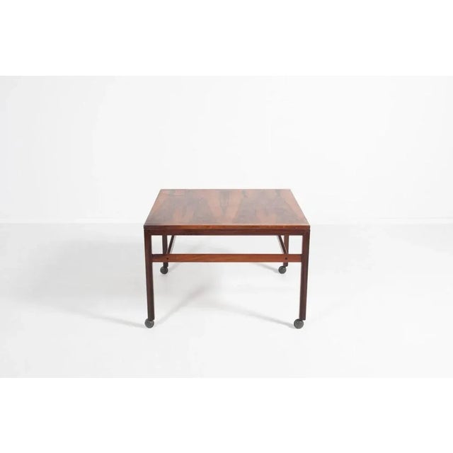 Vintage rosewood veneer coffee table from 1970’s produced by Haslev Mobelfabriek, equipped on wheels. Condition Fair, some...