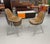 Group of 6 Eames stackable fiberglass shell chairs with original brown naugahyde pads. The famous Charles and Ray Eames...