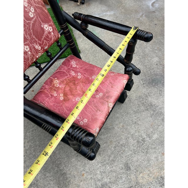 Up for consideration is a beautiful vintage spool wooden rocking chair with red cushions. This is a lovely accent piece...