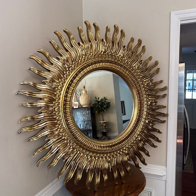 Bring iconic 1970s retro style into your home with this striking vintage sunburst wall mirror. Featuring a bold round...