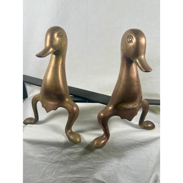 An exceptional and highly unusual pair of vintage mid-century modern sculptural fire dogs / andirons depicting stylized,...